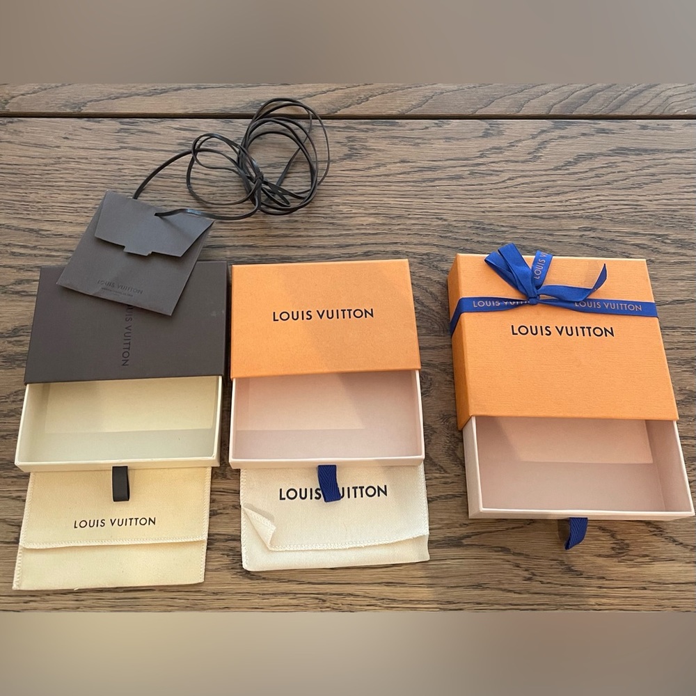 Three authentic Louis Vuitton boxes plus two cotton inserts